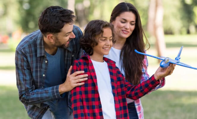 Family with model airplane