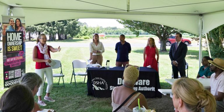 Director Cynthia Karnai speaking outside at the event to celebrate a $500 million partnership with Discover bank and new homeownership programs.