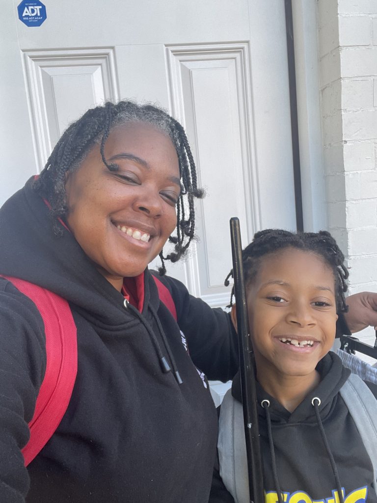 Jennie Steward celebrating her new home with her son.