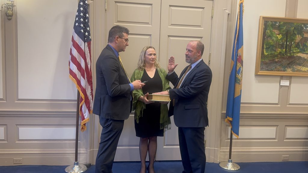 Director Matthew Heckles being confirmed by Governor Matt Meyer.