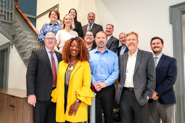 The Affordable Housing Production Task Force gathered on the steps to celebrate the release of the report.