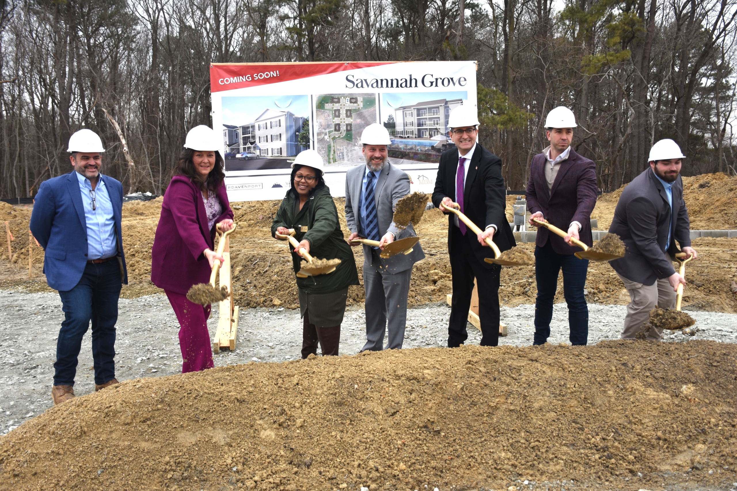 State leaders celebrating the groundbreaking of Savannah Grove with a traditional dirt toss.