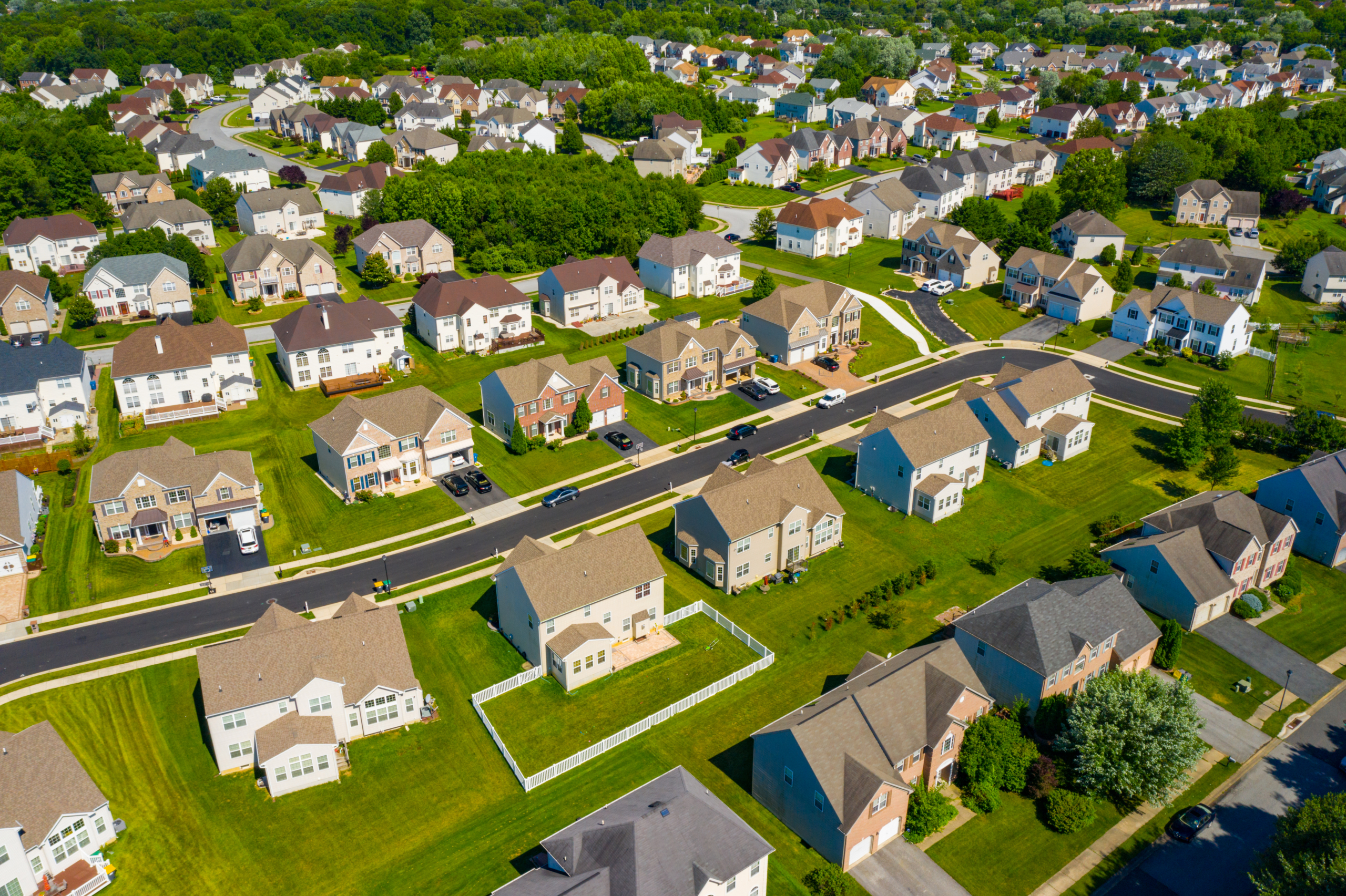 Aerial view of a Delaware residential subdivision with single-family homes and tree-lined streets